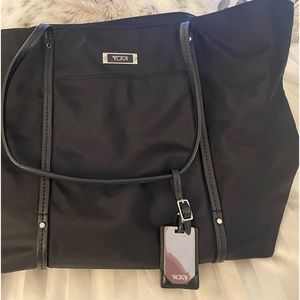 TUMI tote, waterproof material, with tag